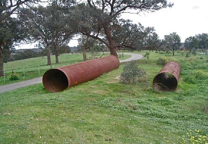 Abandoned siphon pipes beside the pathway through the aqueduct reserve - Photo: Russell Yeoman